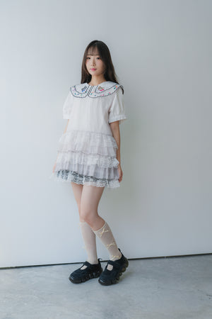 Sheer and lace layered vest