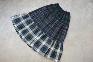 And a three-layer plaid skirt