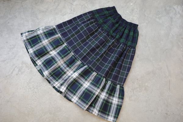 And a three-layer plaid skirt