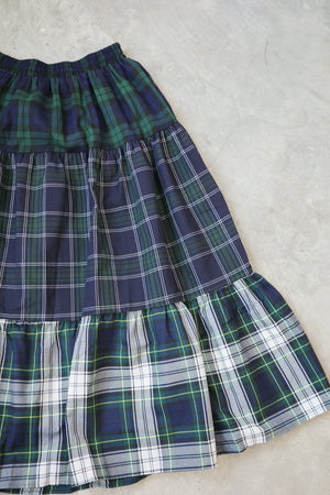 And a three-layer plaid skirt