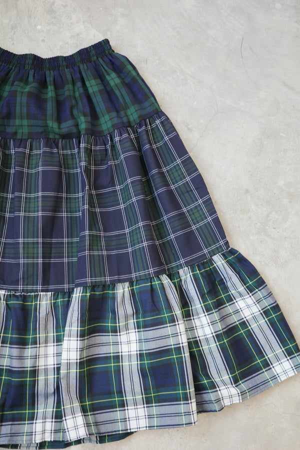 And a three-layer plaid skirt