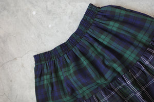 And a three-layer plaid skirt